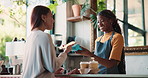 Happy woman, customer and cafe with pos machine for payment, purchase or checkout order on counter. Female person, barista and smile with phone, tap to pay or wireless transaction in coffee shop