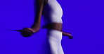 Fitness, hands and jump rope in studio for workout, training and cardio on blue background. Exercise, skipping or woman with equipment for endurance, sports and agile with calorie burn for health
