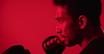 Sports, boxing and man in studio for workout, self defense or training for competition with active. Fitness, space and male person with gloves for fighting or exercise with red light by background.
