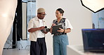 Photographer, director and production with planning, discussion and studio for collaboration or shoot. Art, photography and man with woman on set together for teamwork, magazine or catalog session