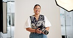 Photographer, face or woman on set with camera, pride or job goals in media agency. Confidence, laugh or cameraman in studio with photoshoot equipment, career or experience in film industry.