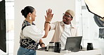 Photographer, people and high five in studio with laptop, campaign success or production achievement. Photography, team and celebration on set with computer, creative collaboration or accomplishment.