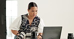 Woman, laptop and camera in studio for photography, project management and review at media company. Person, photographer and gear with computer, editing or production process at creative agency