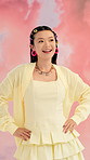 Fashion, photoshoot or Asian woman with outfit, bold color or gen z style on studio background. Smile, trendy or female person with confidence, catalog or maximalist aesthetic in media production.