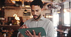 Reading, check and man in cafe with tablet, website review and inventory management with sales track. Hospitality, stock checklist and owner with tech, online order or menu update on restaurant app.