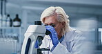 Development, microscope and science with woman in laboratory for investigation or research. Analysis, goggles and medical experiment with mature scientist at work on clinical trial or sample