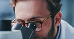 Scientist, glasses and man with microscope, lab and analysis for vaccine, vision or medical research. Science, innovation and person with equipment for medicine, eyewear and healthcare in clinic