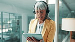 Telemarketing, headset and woman in office, tablet and consultation for help desk. Mature person, call center and professional in workplace, tech or contact us for customer service, crm or advice