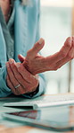 Woman, hands and wrist pain in workplace with computer, accounting or joint inflammation from typing. Hurt, person or accountant in office with desktop, keyboard or tired from carpal tunnel syndrome.
