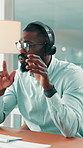 Call center, conversation and black man in office with headset, contact us or advice in crm service. Professional, help and consultant with microphone, online assistance or feedback in client support