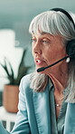 Call center, telemarketing and woman talking in office for lead generation, telesales or insurance. Headset, hotline and mature agent with tech, policy premium and speaking to customer for sales