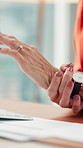 Hands, arthritis and typing with wrist pain at office for carpal tunnel, computer or fatigue at startup. Person, pc and joint inflammation with sore muscle, injury or fibromyalgia at creative agency