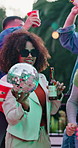 Woman, friends and dancing with alcohol at party, social gathering and rhythm at rave event. Bokeh, smile or people with disco ball, listening to music and celebration with energy for festive reunion