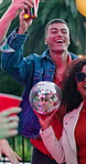 Man, friends and dancing with alcohol at party, social gathering and rhythm at rave event. Bokeh, smile and people with disco ball, listening to music and celebration with energy for festive reunion
