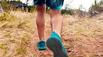 Running, outdoor and legs of man for fitness, exercise and cardio workout for wellness. Athlete, mountain and person on nature trail with active hobby for health, endurance and challenge for training