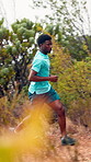Running, man and fast in nature, outdoor and workout routine for health, active or training in woods. Serious, runner and black person with endurance for exercise, fitness and wellness in forest