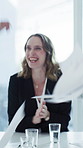 Documents, applause and woman with team with success in meeting for goals, financial growth and profit. High five, business and workers with papers in air for achievement, celebrate and finance deal