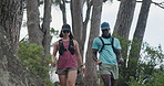 Fitness, couple and hiking on mountain with workout, exploration and conversation for wellness goals. Active, people and walk in nature with outdoor adventure, exercise chat and healthy relationship.