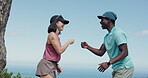 Laughing, couple and fist bump in nature, fitness and hug after exercise routine, happy and bonding. Outdoor, athlete and interracial people with smile for wellness, embrace and secret handshake