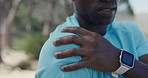 Hand, outdoor and man with shoulder pain, fitness for health benefits and joint injury. Person, nature and hiker with muscle tension, sore and inflammation with exercise, workout accident and ache