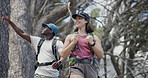 Fitness, couple and hiking on mountain with backpack, exploration and conversation for wellness goals. Low angle, people and talk in nature with outdoor adventure, trekking and healthy relationship.