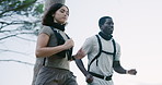 Active, fitness and running with couple outdoor in nature for adventure, bonding or cardio activity. Exercise, health and wellness with interracial runner people in mountains for action or challenge