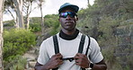 Fitness, face or hiker in forest with gear, pride or progress in outdoor workout. Sport, portrait and black man in nature with sportswear, trekking exercise or training confidence in body improvement