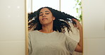 Natural, girl and hair treatment results in mirror for frizz control, hydration and getting ready. Reflection, african woman and happy in home bathroom for curls texture, healthy growth and haircare