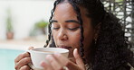 Wellness, thinking and woman in backyard with coffee, calm and satisfaction on weekend break. Reflection, drinking and female person at home with warm beverage, mindfulness and gratitude in free time