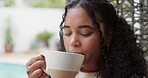 Wellness, thinking and woman in backyard with mug, calm and satisfaction on weekend break. Reflection, drinking and female person at house with coffee, mindfulness and gratitude in free time.