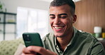 Reading, smile or man with phone in lounge, check digital photo album or typing response for web chat. Texting, laugh or happy person with mobile for message notification, home or browsing internet