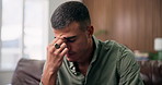 Frustrated, man and headache with stress in home for mental health, depression or anxiety. Tired, male person or mistake with migraine or fatigue for burnout, regret or crisis on sofa in house