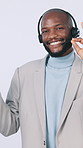 Black man, consultant or pointing with headset in studio for CRM marketing on a white background. Portrait, businessman or friendly agent with smile for advertising, online tips or virtual assistance
