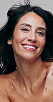 Face, hair care and woman in studio, happiness and dermatology on white background. Mature person, smile and aesthetic for shine, wellness or beauty for growth, volume and cosmetics for healthy scalp
