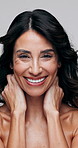Face, skincare and happy woman in studio with beauty, natural aesthetic and healthy skin texture. Portrait, dermatology and mature person with touch for anti aging, body care and white background