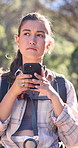 Smartphone, hiking and woman in forest, thinking and app for direction, internet or digital map glitch. Lost, hiker or person in woods, confused or cellphone for location, trekking or journey update