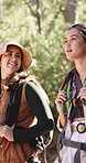 Friends, hiking and adventure in nature with backpack, sightseeing and discussion for bonding together. Bokeh, people trekking and women outdoor on trail with bag, exploration or travel conversation.