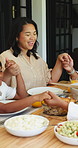 Lunch, holding hands and prayer with family outdoor for bonding, eating and connection. Holiday celebration, healthy food and love with people in backyard of home for care, worship and dining table