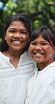 Face, girls and hug with sister outdoor, bonding and laugh on break in nature or together on holiday. Happiness, children and embrace at park on vacation, love and hangout with sibling in Philippines