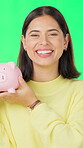 Face, woman and savings on green screen with piggy bank, investment growth or smile for coin collection. Happy, person and cash container in studio with money management, financial freedom or budget.