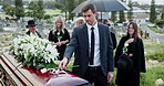 Man, casket and rose for respect at funeral with grief, goodbye or mourning with compassion at cemetery. Person, coffin and remembrance with white flower, farewell and burial service at graveyard