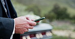 Funeral, texting and hands outdoor with phone, family arrangements or update on reception details. Typing, bokeh and man in cemetary with tech, ceremony schedule or online chat at memorial service.