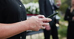 Funeral, digital or hands outdoor with phone, family arrangements or update on reception details. Texting, bokeh and woman in graveyard with tech, ceremony schedule or online chat at memorial service