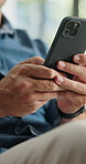 Hands, man and reading with phone at house for games, browsing website and networking. Male person, typing or mobile app on couch for streaming movies, social media and notification of message update