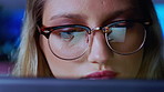 Night, programmer and woman in office, glasses for clear vision and research for software update. Coding, problem solving or person in workplace, eyewear or reflection with online reading and evening