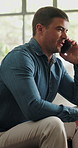 Man, phone call and relax on sofa with talk in home for contact, communication or chat in lounge. Person, smartphone and discussion with mobile network, listen or chat in living room at apartment