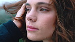 Wind, calm and woman outdoor with thinking on holiday, weekend trip or getaway with relax. Memory, ideas and female person with breeze in hair for break, vacation or travel in nature with mindfulness