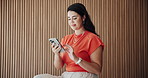 Phone, smile and businesswoman in office with chatting, social media or texting on mobile app. Technology, happy and female person with cellphone for typing email, communication or contact at agency.