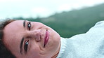 Face, relax and happy woman in nature for vacation, peace and reflection with calm on weekend break. Smile, portrait and person rest outdoor in countryside for holiday, vision and thinking in Germany