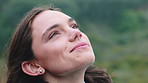 Woman, peace and fresh air in nature with smile, mindfulness or thinking for inspiration on vacation. Happy person, breathing and tranquility outdoor with memory, zen reflection or relax for holiday.